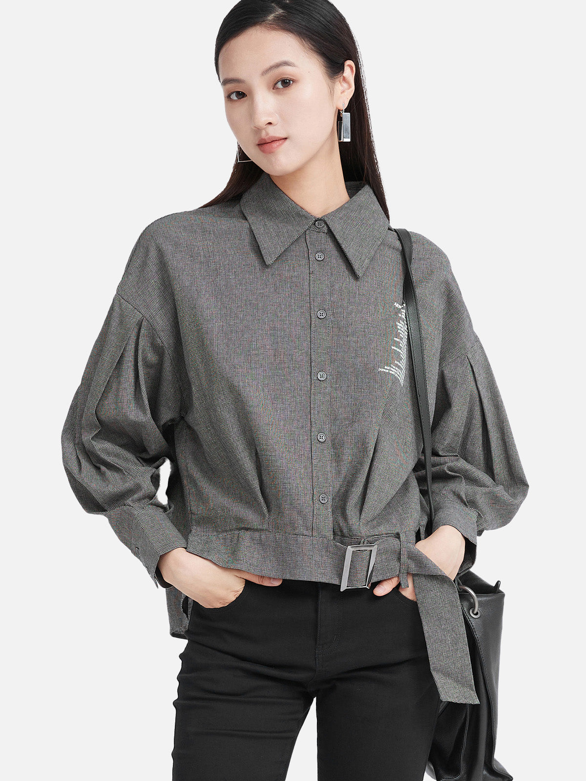 The waist-cinched design of the long-sleeve letter striped shirt showcasing the graceful curves of women