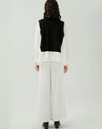 Modern Fashion Contrast Shirt with Ruffled Edges: A contemporary design with delicate details.