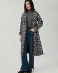 Irregular grid pattern adding a touch of artistry to your overcoat