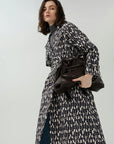 Showcasing your curves with a belted double-breasted overcoat