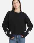 Halloween sweater with embroidered ghosts: Adding a touch of humor to your holiday ensemble.