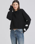 Stylish seasonal apparel with embroidered ghosts: Standing out during the holiday season.