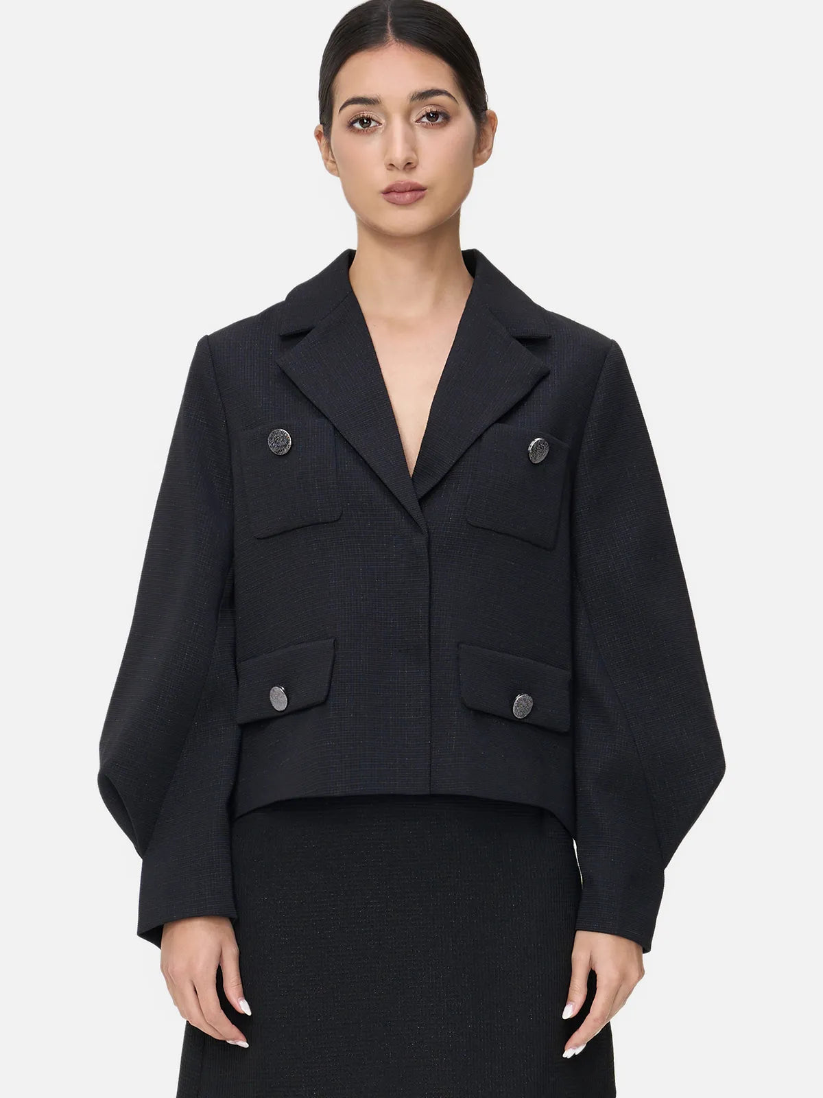 Elevate your style with this chic black coat, featuring a lapel V-neck and lantern sleeves for a sophisticated and unique look.