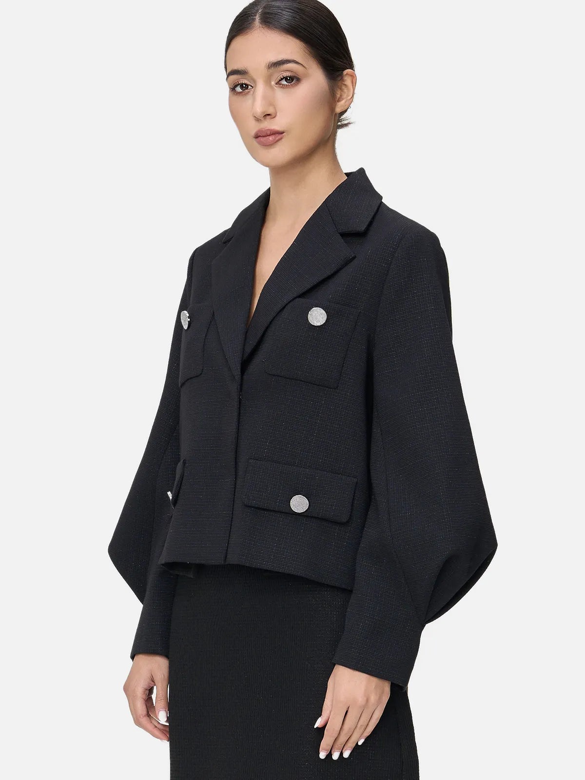 Discover timeless elegance in this black outerwear, where the classic lapel meets a trendy V-neck, complemented by the whimsy of lantern sleeves.