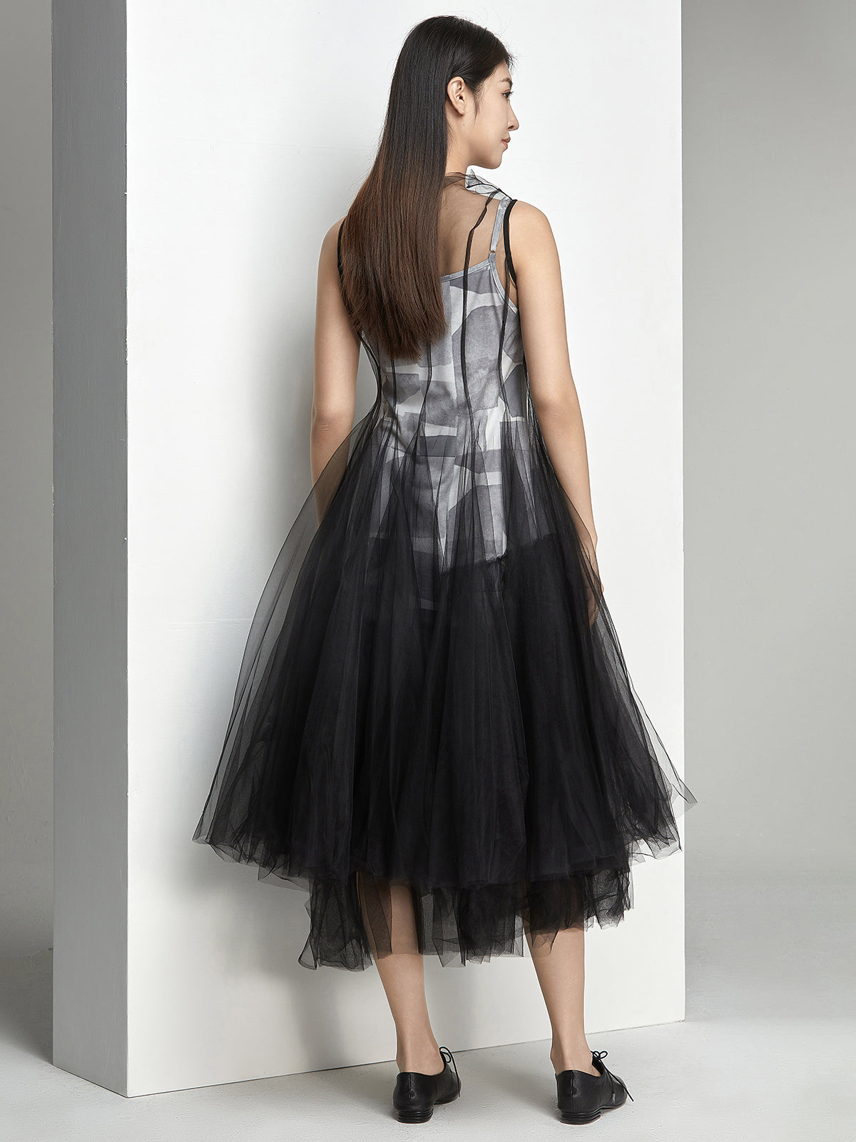 Back view of black tulle dress with lightweight flowy layers