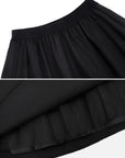 Women's black skirt with a tasteful mid-length design, combining modest coverage and stylish allure