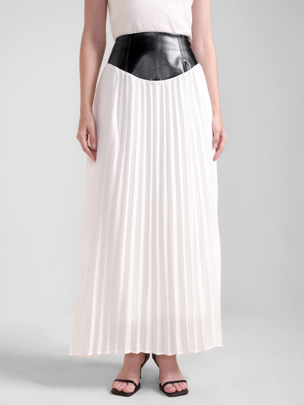 S·DEER black and white pleated midi skirt with faux leather waist, contrast design, and flowy silhouette for women