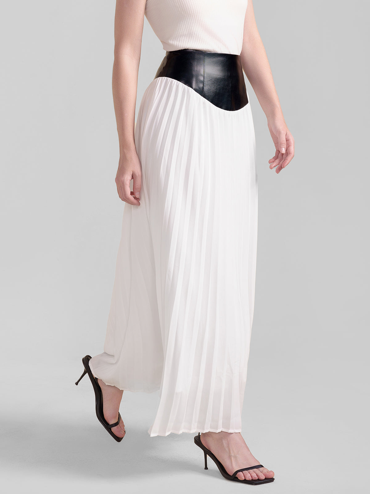 S·DEER black and white pleated midi skirt with faux leather waist, contrast design, and flowy silhouette for women