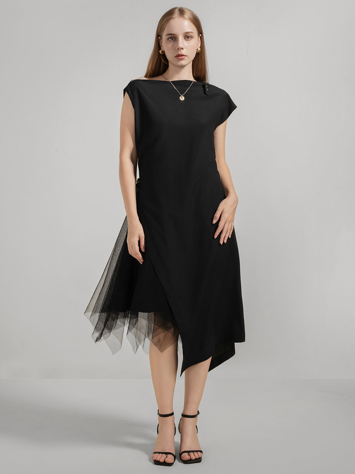 Black asymmetrical dress with cap sleeves and tulle hem detail – front view