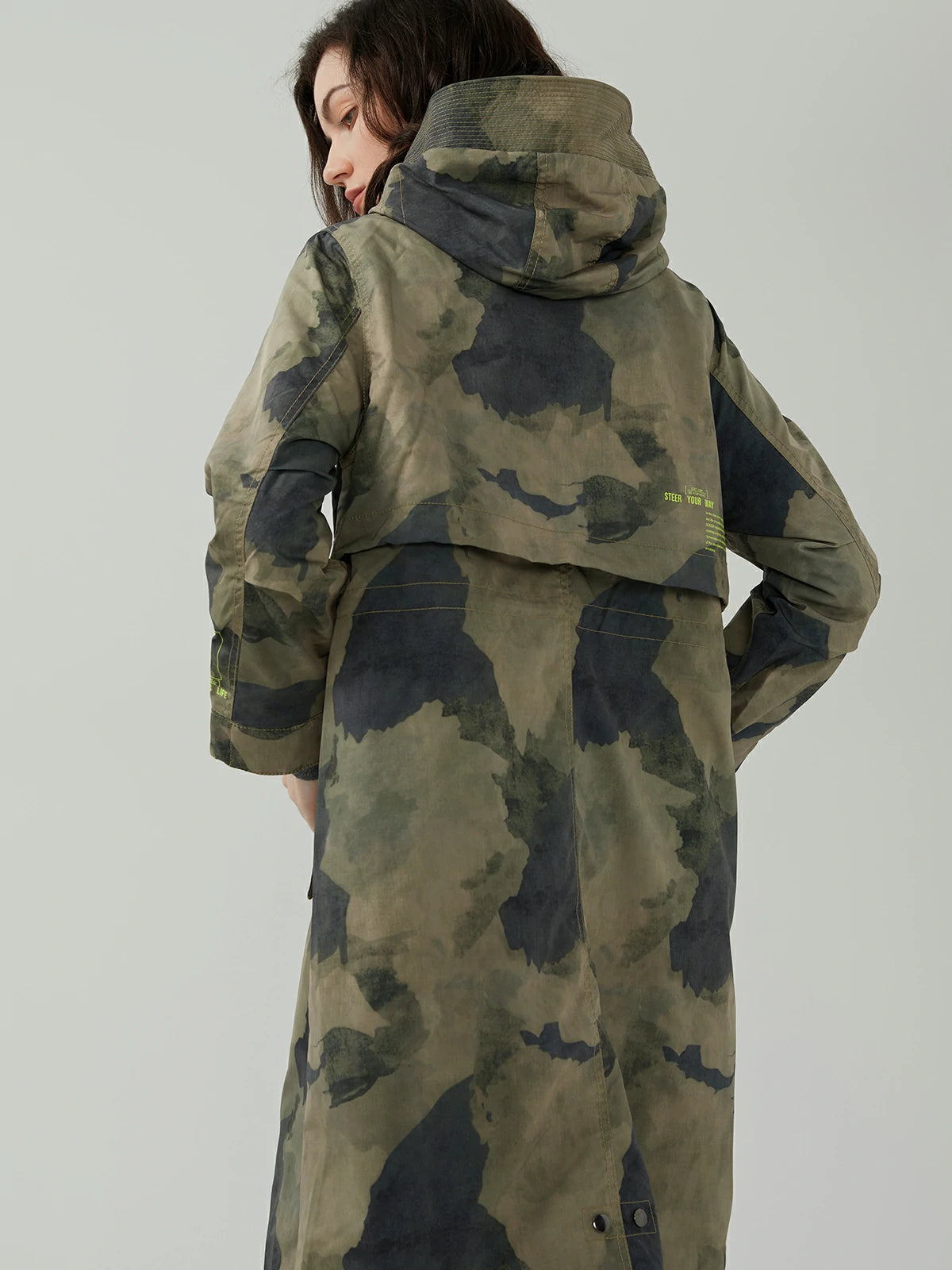 Fashion-forward outerwear with a trendy blend of camouflage and fluorescent letter elements