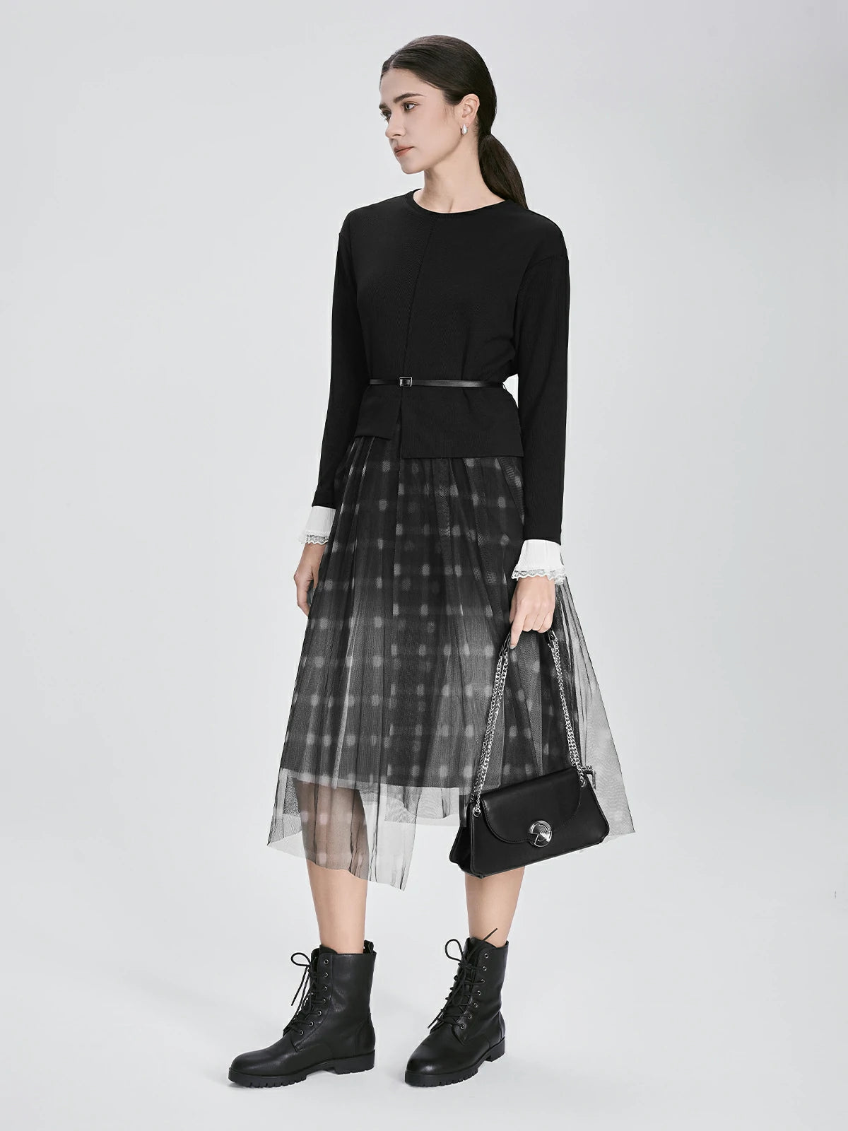 Side view of S·DEER black dress with long sleeves and a tiered checkered tulle skirt