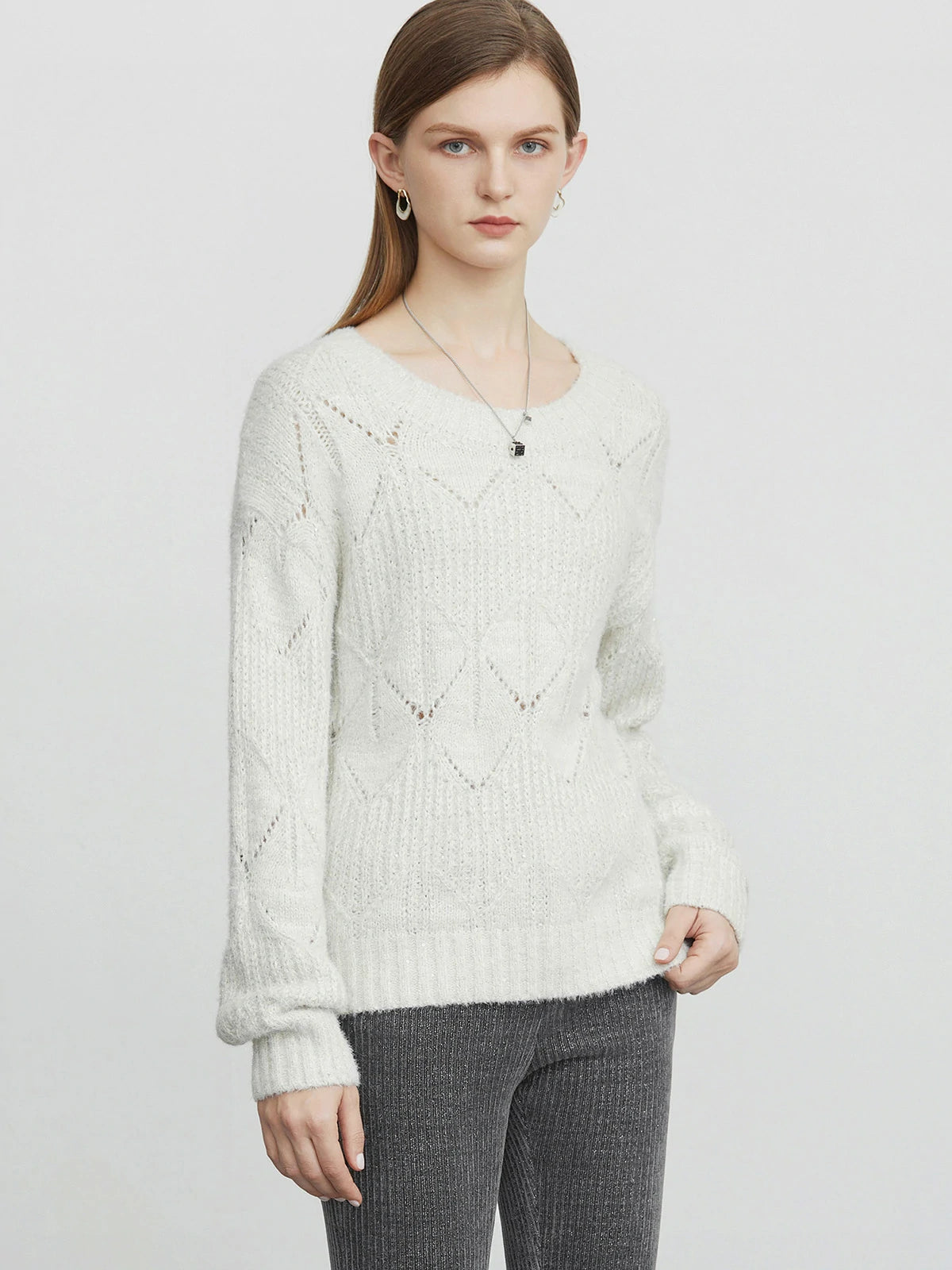 Vintage-inspired knit sweater with round neck and crochet detailing