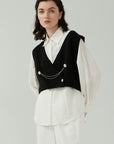Retro chain vest and bubble sleeve shirt's fashion: Combining style and comfort.