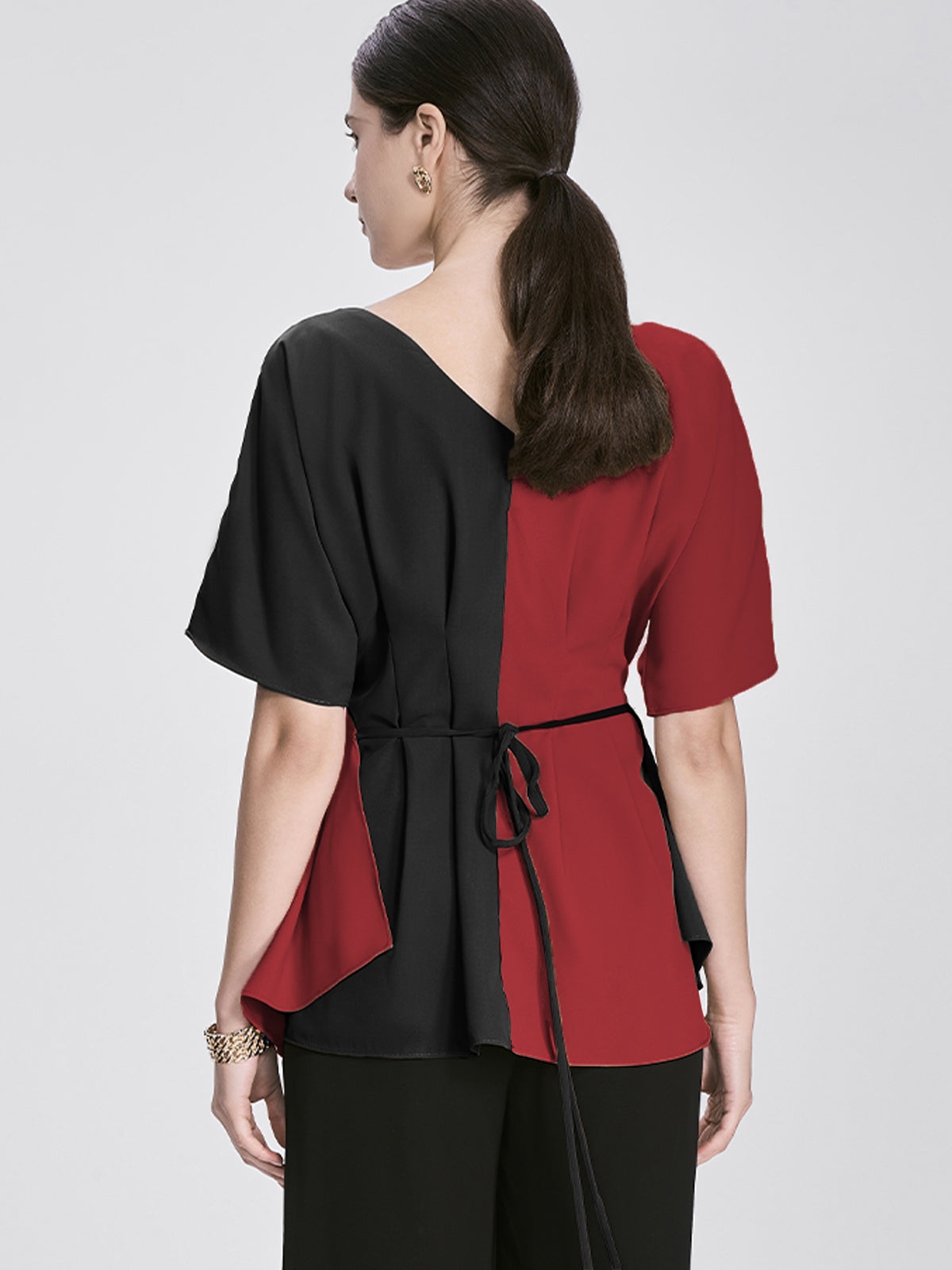 Chic off-shoulder wrap top with contrasting red and black fabric