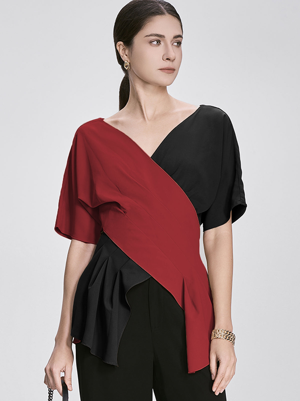 Modern fashion asymmetric blouse in bold red and black color block design