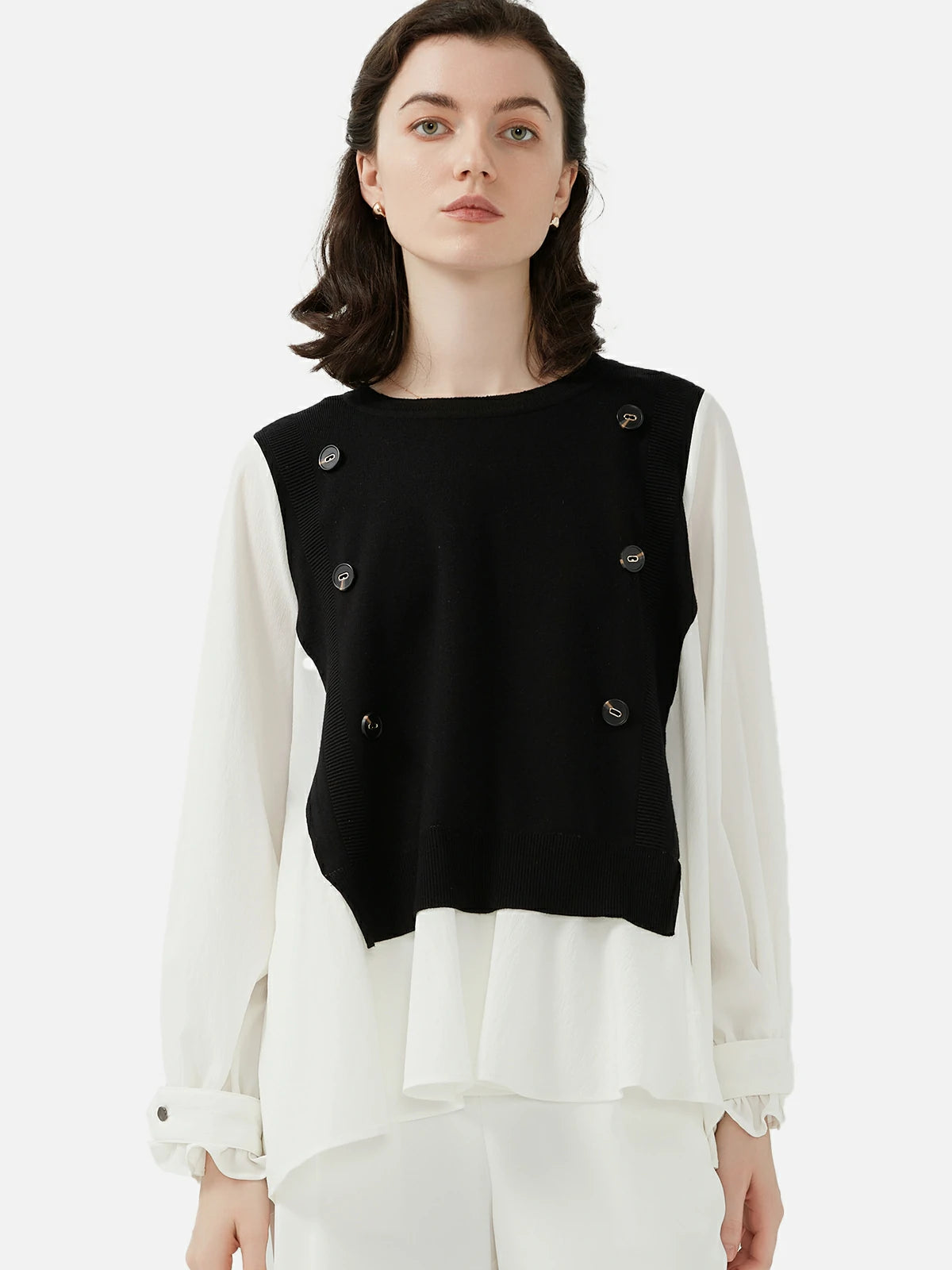 Stylish Black and White Knit Patchwork Shirt: A striking fashion contrast with ruffled edges.