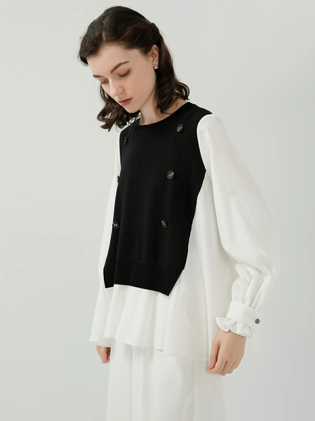 Feminine and Delicate Ruffled Edges on Knit Combination Shirt: Adding a touch of elegance.