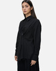Fashion-forward feel with a front knot design on this black shirt