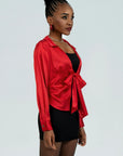 Elegant red shirt featuring satin fabric and front tie detail