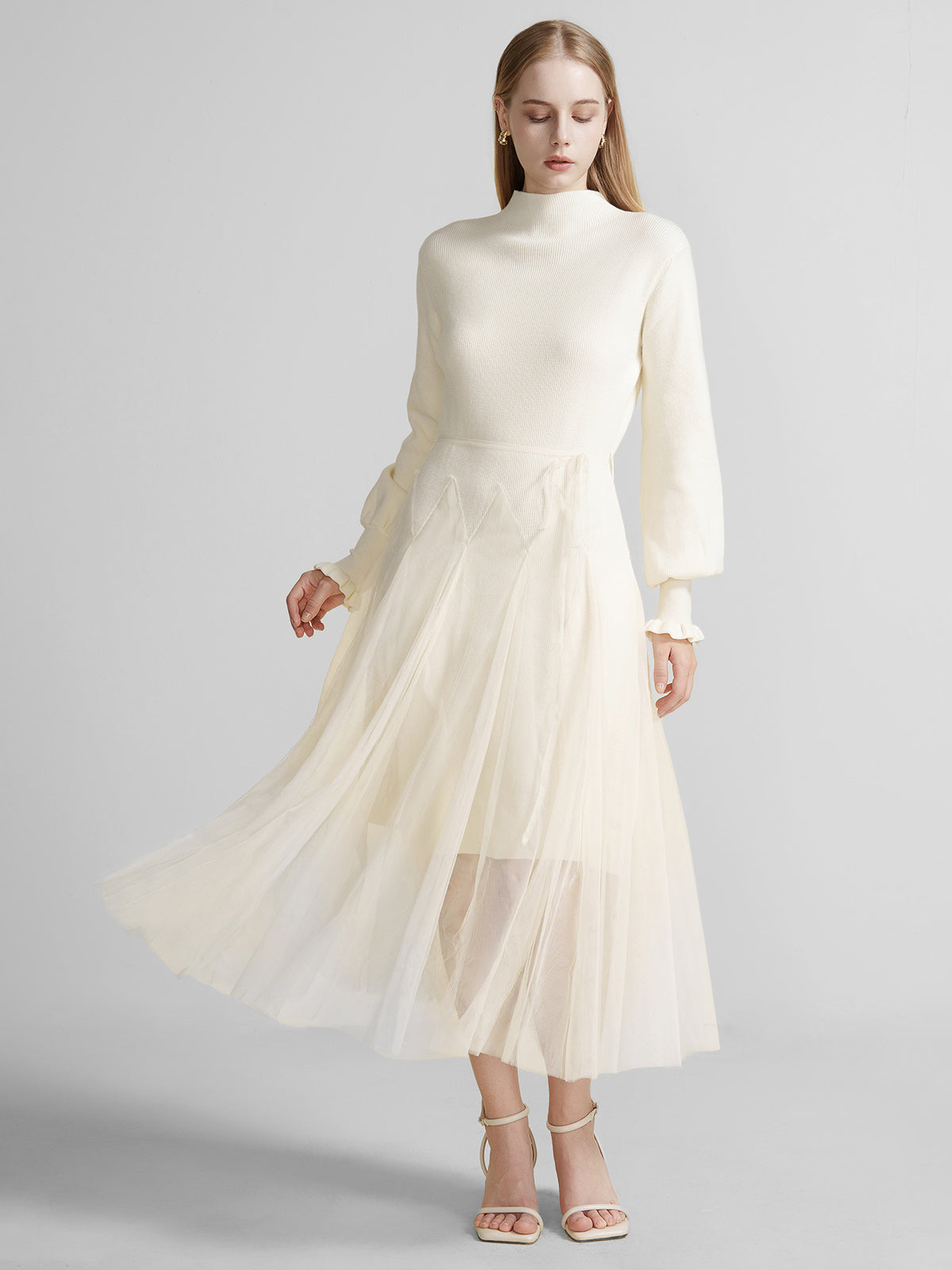 S·DEER ivory knit dress with high collar, long sleeves, and a flowing tulle skirt