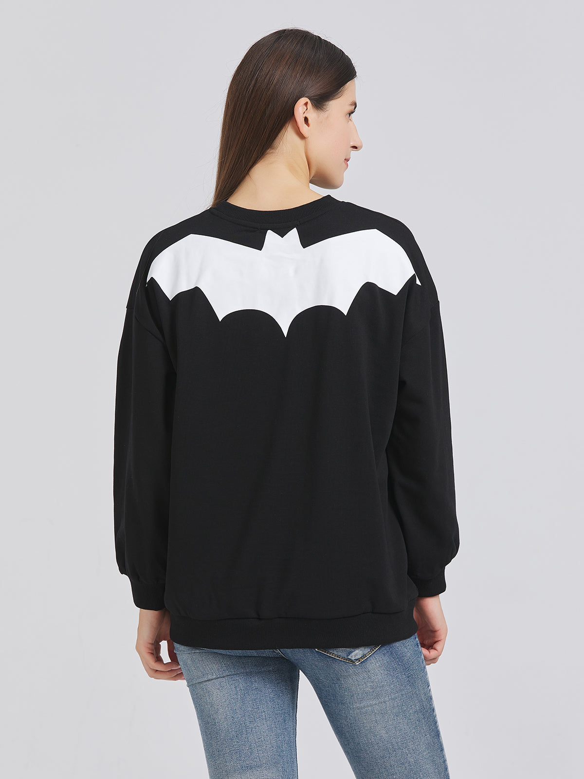 Halloween attire with skull head pattern: Stand out with this fun and festive sweatshirt.