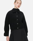 Versatile and chic, this collared black short jacket boasts an eye-catching waffle-grid pattern.