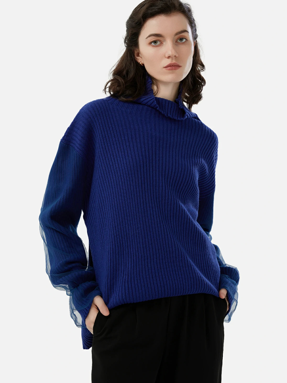 Solid turtleneck sweater with mesh sleeves for versatile styling