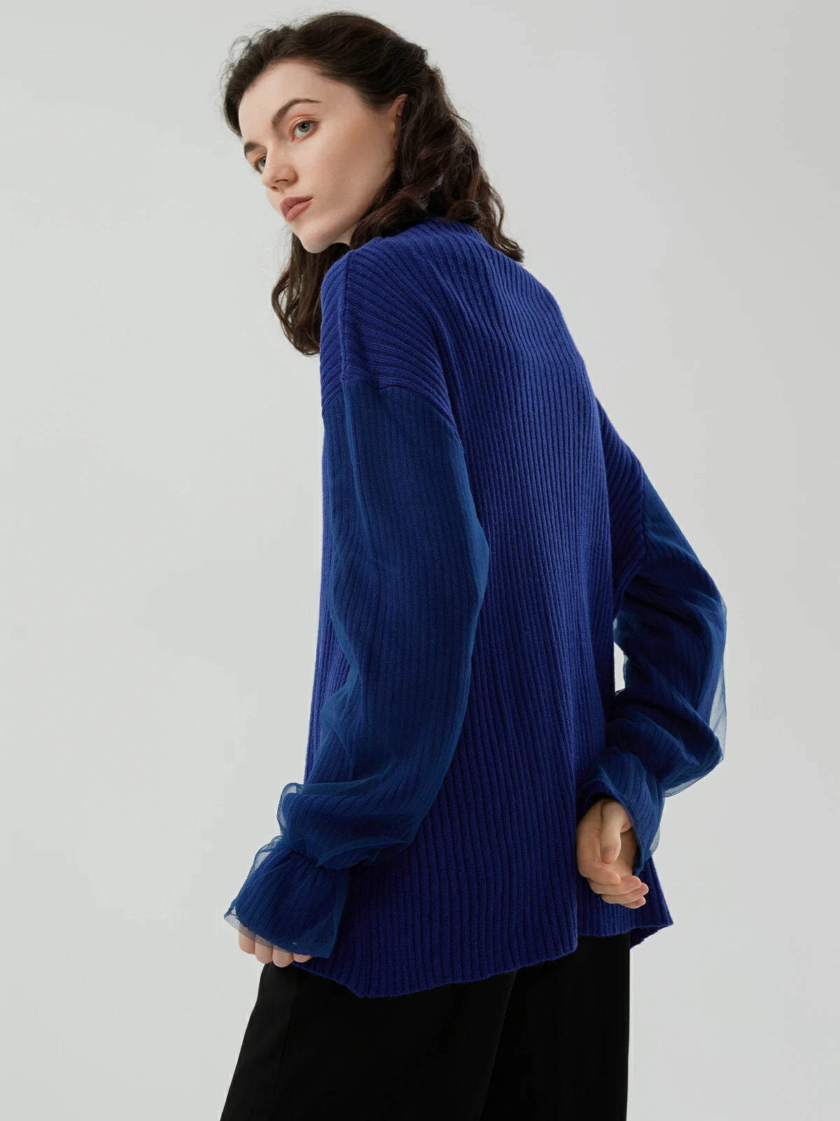 Sophisticated high-neck sweater with unique mesh sleeve design