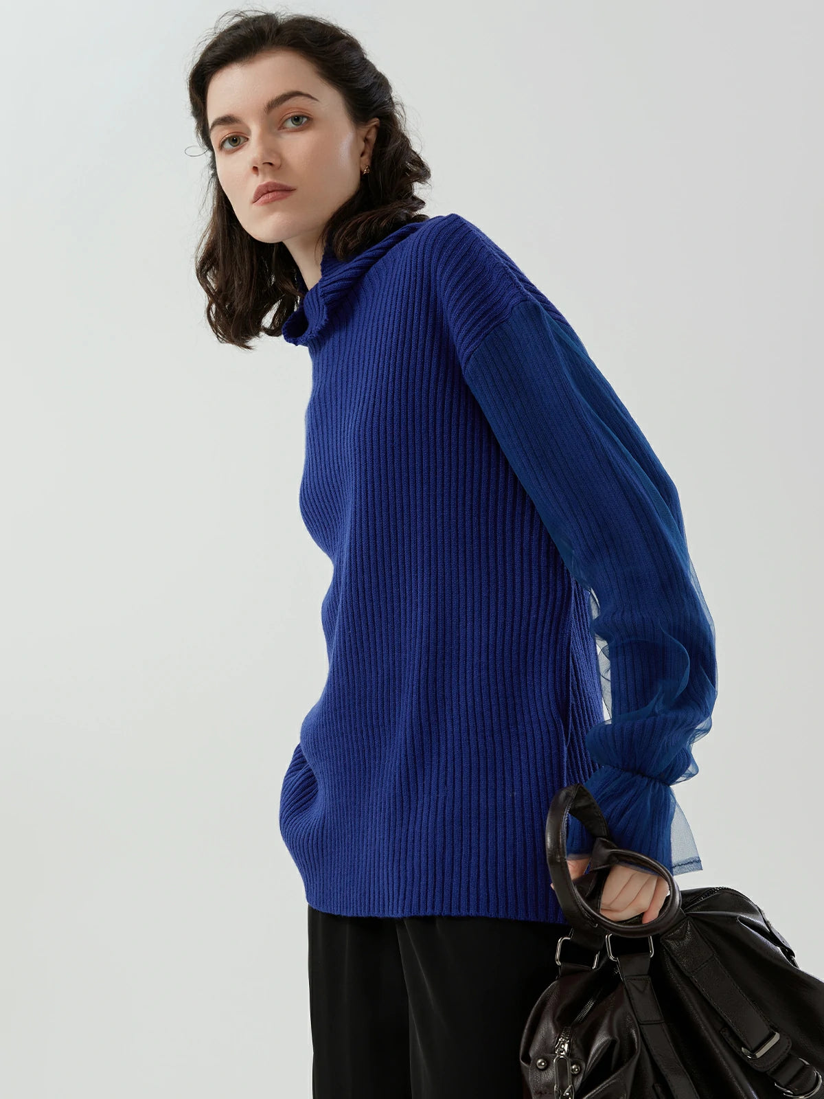 Elegant turtleneck sweater featuring mesh detail for style versatility