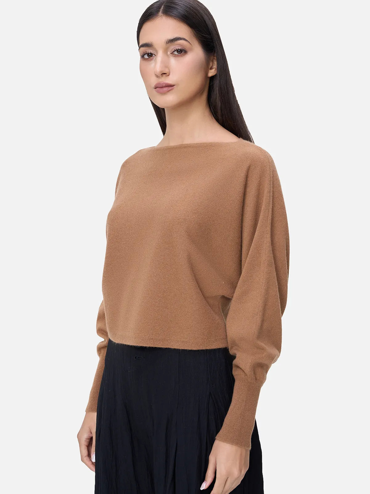 Elevate your winter wardrobe with this chic cashmere sweater, boasting a short length and stylish batwing sleeves in a versatile solid color for a modern and cozy look.