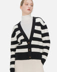 Achieve a contemporary look with this black and white striped V-neck cardigan, boasting a loose fit and elegant button details, seamlessly blending sophistication and relaxed style.