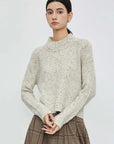 Fashion-Forward Knitwear: Ribbed Round Neck, Irregular Hem, and Dotted Allure