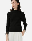 The elegance of lace detailing on a high-quality knit sweater