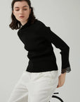 Embracing warmth and style in the winter season with a lace-detailed knit sweater