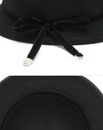 Versatile black wool bucket hat with charming bow