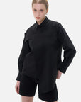 Stylish black shirt with a unique chest panel design, perfect for both professional and casual occasions.