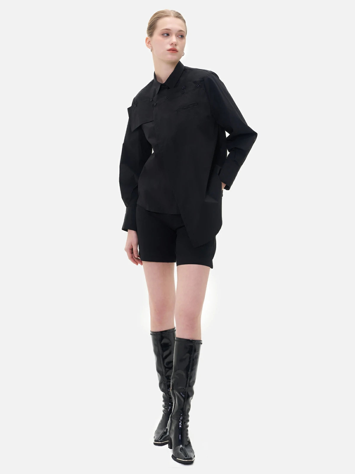 Comfortable and chic black shirt designed with a chest panel, effortlessly combining fashion and ease for everyday wear.