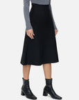 Sophisticated Knit Fabric: Embrace sophistication with the rich black knit fabric of this A-line skirt.
