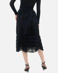 A both stylish and elegant black V-shaped pleated semi-transparent midi skirt, suitable for various occasions.