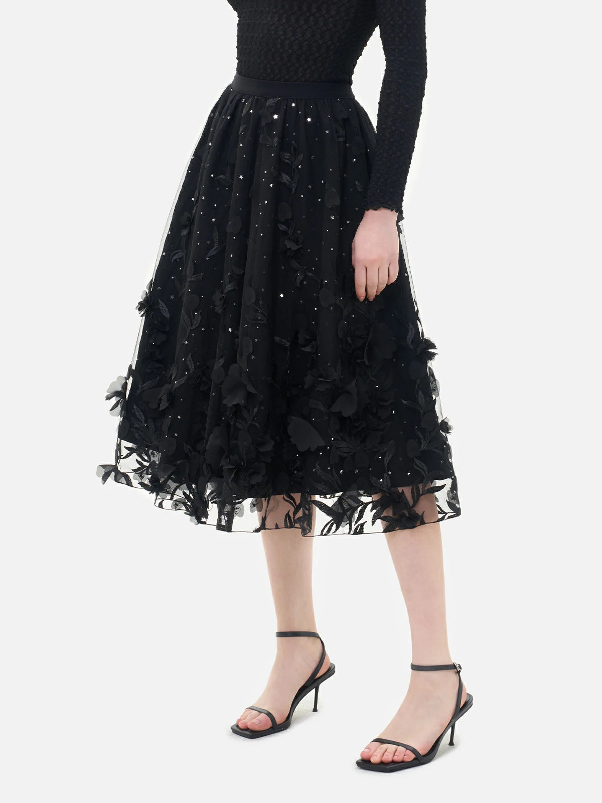 Lightweight sheer chiffon midi skirt featuring embroidered details and appliqué, showcasing artistic craftsmanship.