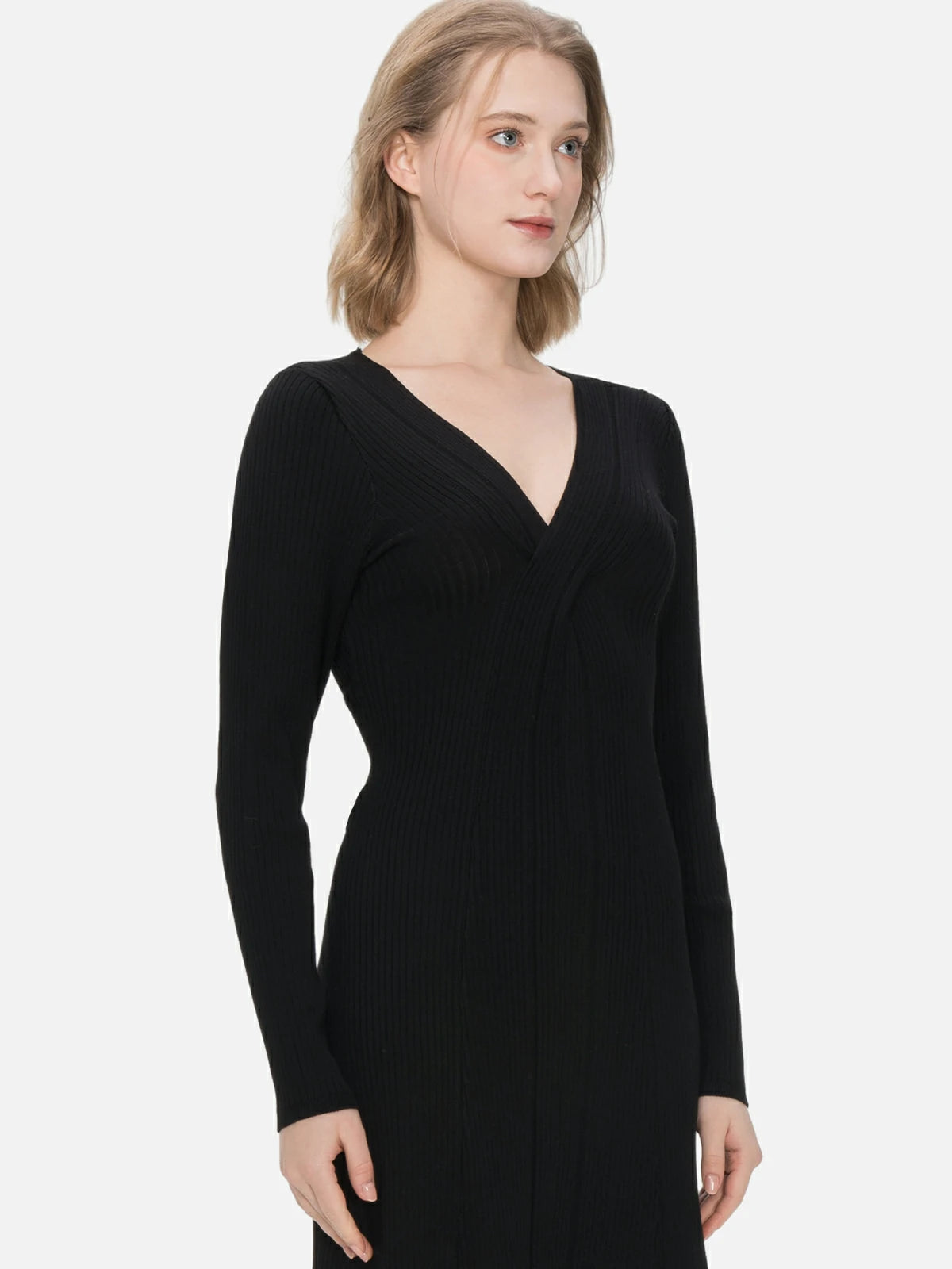Make a statement in this classic black midi dress with a cross V-neck design, embracing a body-hugging silhouette and intricate knit detailsl.