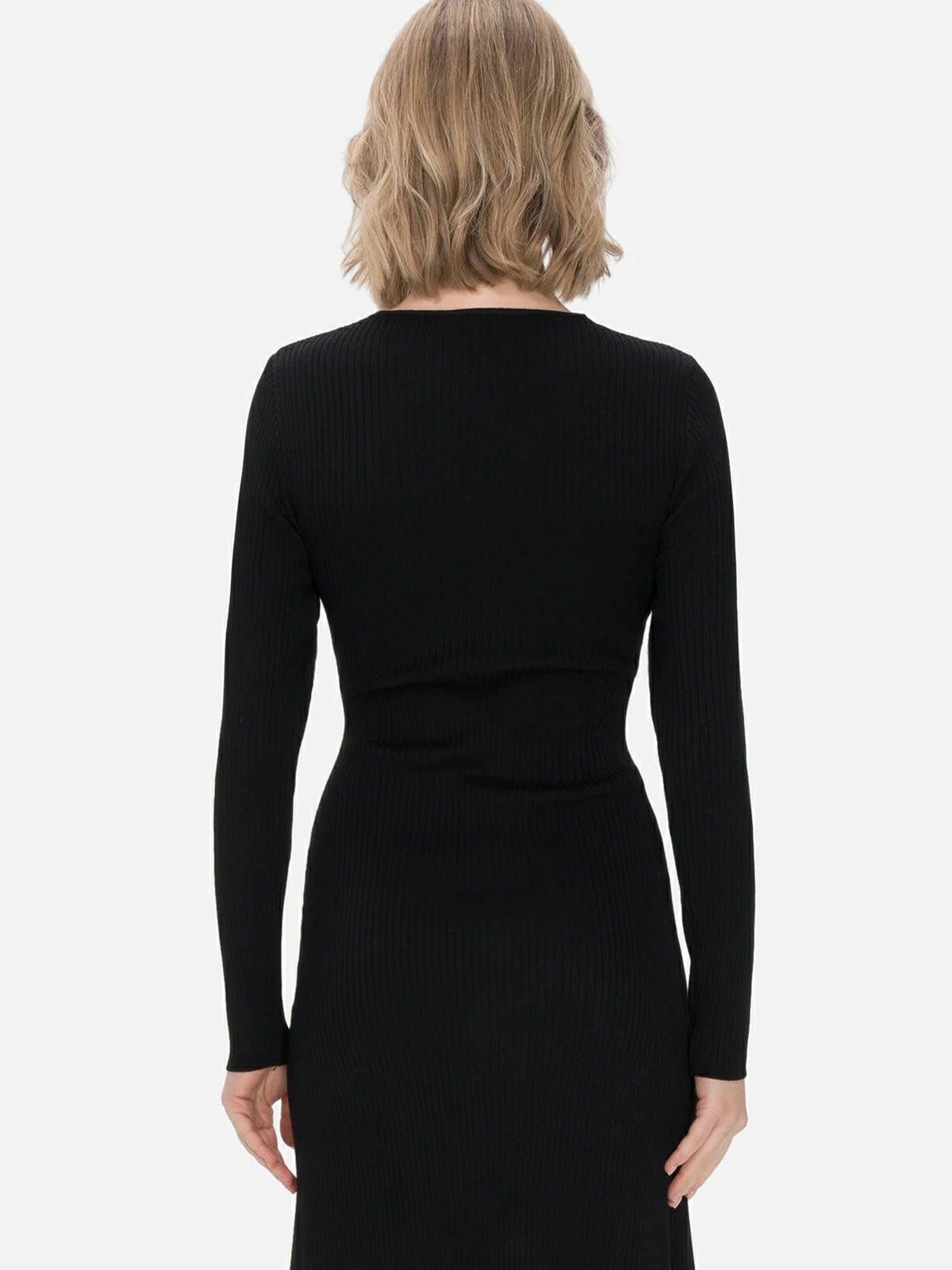 Discover the perfect fusion of fashion and elegance in this black knit midi dress featuring a cross V-neck design, versatile occasion wear.