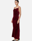 A velvet spaghetti strap maxi dress with irregular V-neck and pleated detailing, showcasing the graceful charm of women
