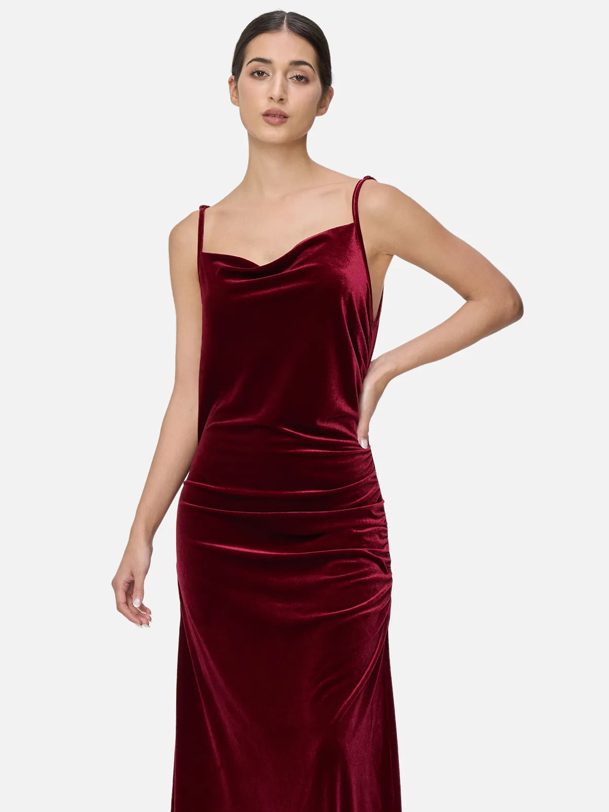 Fashionable women&#39;s clothing with a velvet spaghetti strap maxi dress featuring fluid layered effect design