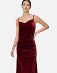 Fashionable women's clothing with a velvet spaghetti strap maxi dress featuring fluid layered effect design