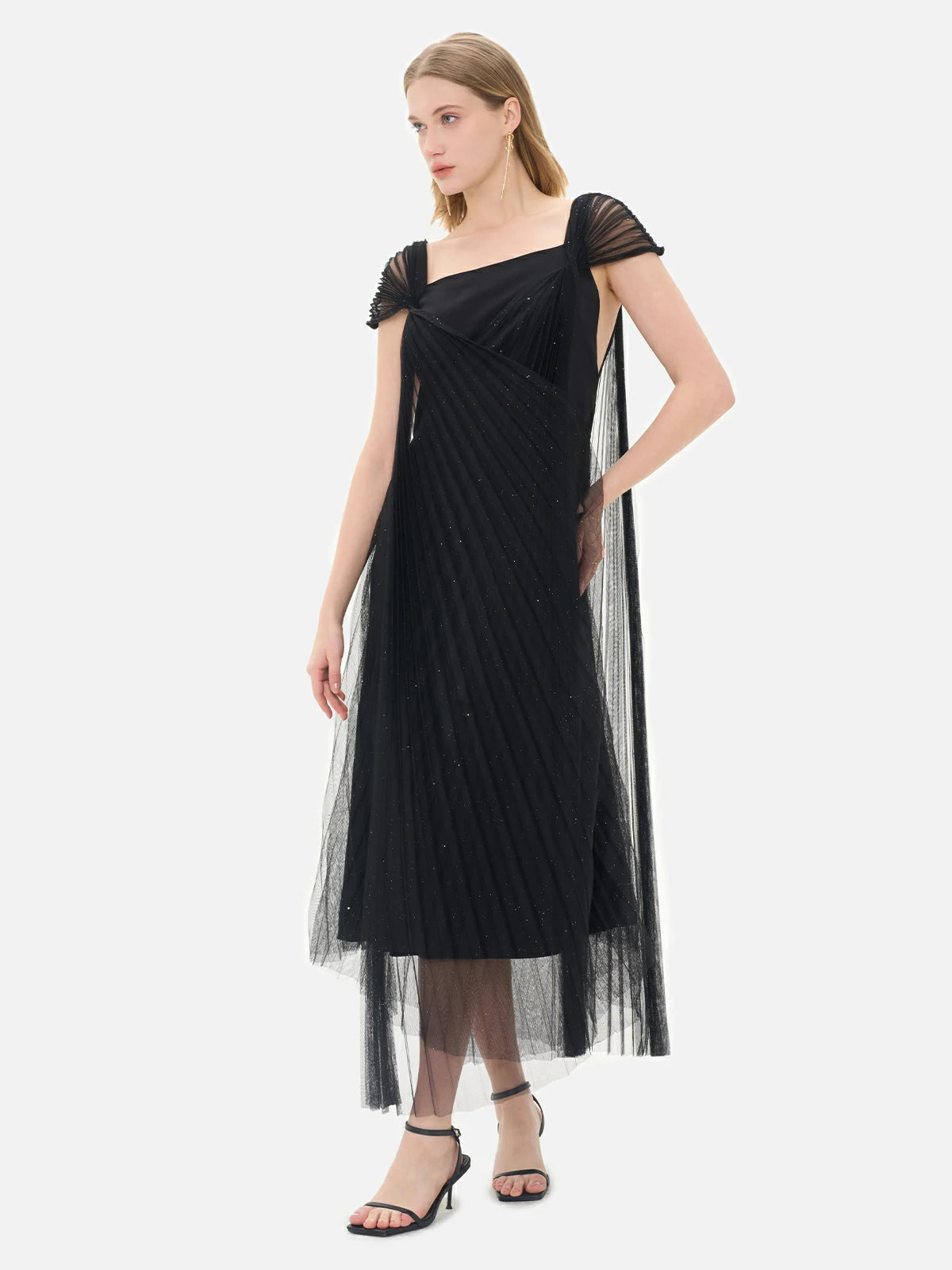 Formal black gown featuring a unique crisscross pleated mesh design, cap sleeves, and intricate sequin embellishments for a luxurious look.