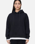 A uniquely designed black loose-fitting hooded sweatshirt 
