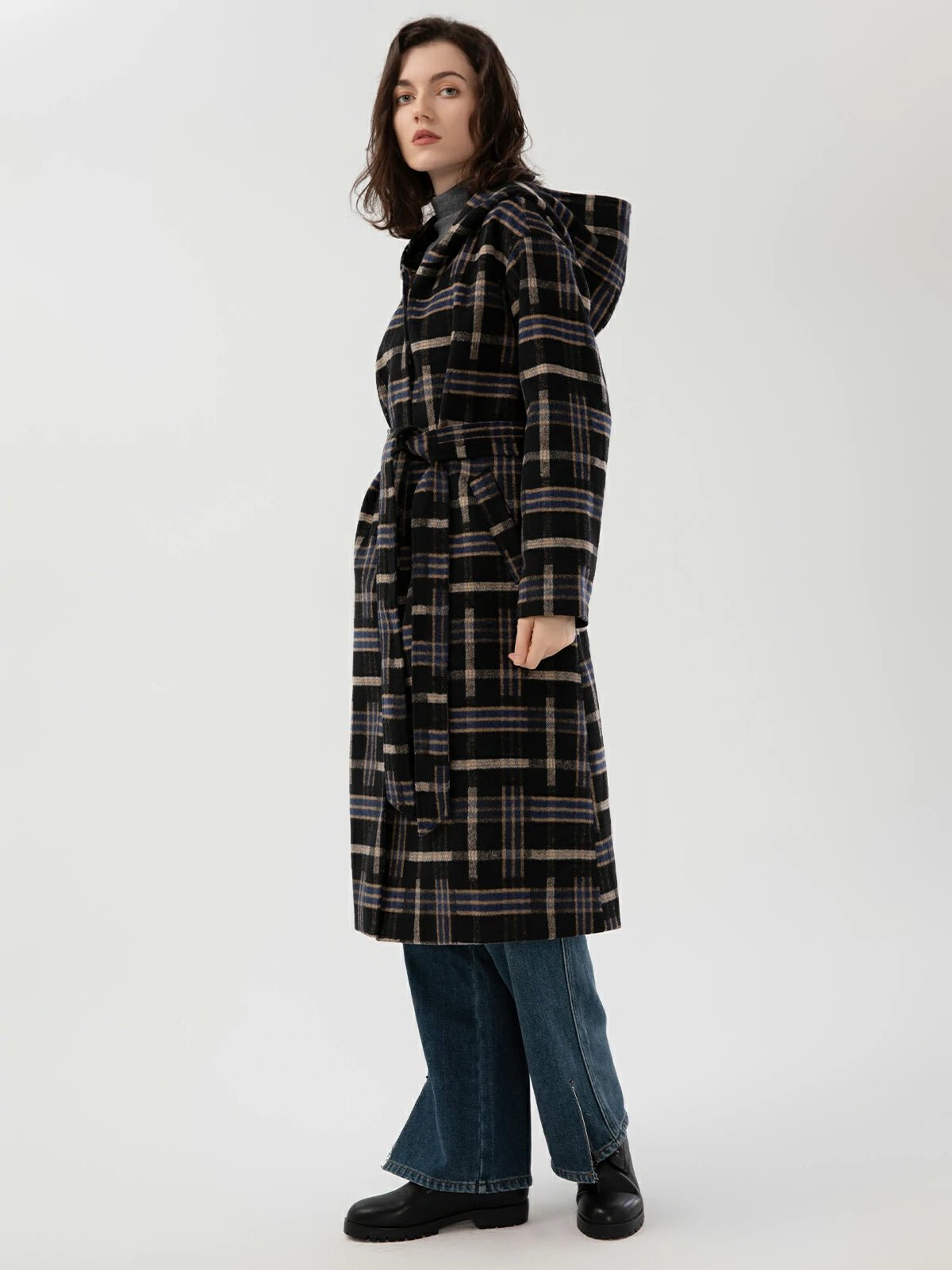 Long woolen coat with a coordinated belt, adding a touch of elegance