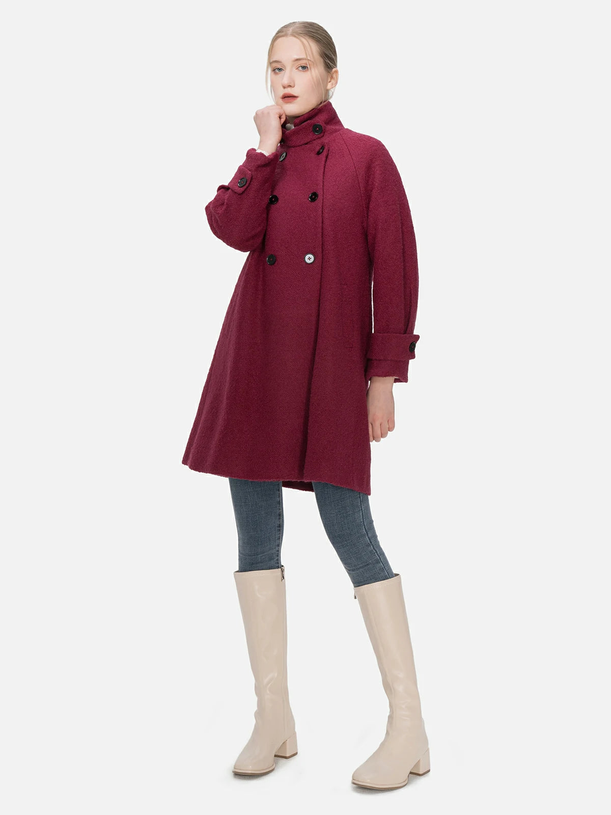Redefine your outerwear collection with this deep magenta wool coat, showcasing both stand collar and lapel designs, a double-breasted silhouette, and an exquisite fusion of classic and modern style.
