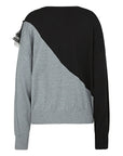Achieve a timeless and fashionable look with this color-blocked sweater, featuring a classic black and gray palette and a modern diagonal cut design that effortlessly combines tradition with trend.